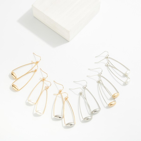 Metal Tone Cone Drop Earrings Featuring Barrel Bead Detail 
- Approximately 2" L