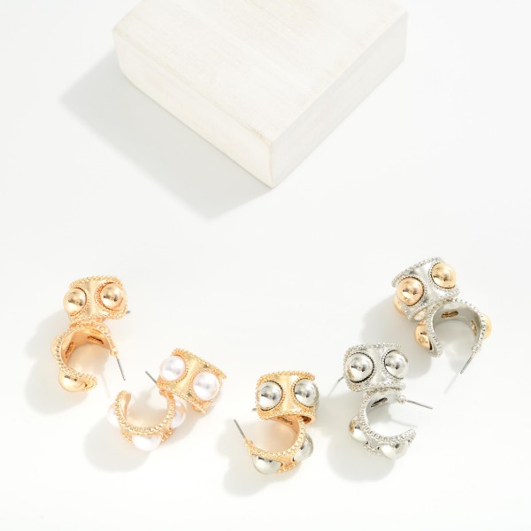 Chunky Metal Tone Hoop Earrings Featuring Dome Details 
- Approximately .75" D