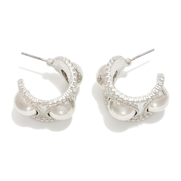 Chunky Metal Tone Hoop Earrings Featuring Dome Details 

- Approximately .75" D