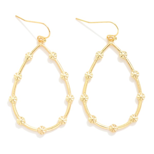Metal Tone Teardrop Earrings Featuring Starburst Details

- Approximately 2.25" L