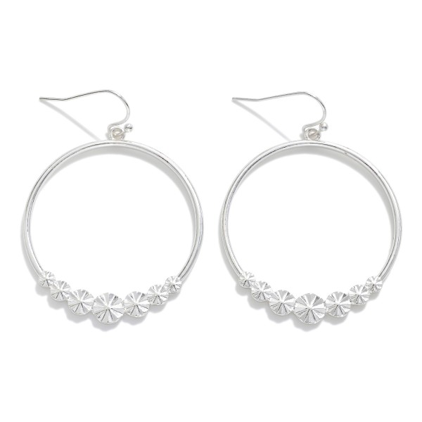 Metal Tone Hoop Drop Earrings Featuring Starburst Details 

- Approximately 2.25" L