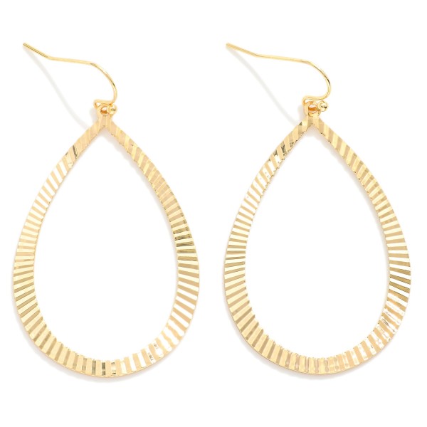 Metal Tone Teardrop Shaped  Drop Earring Featuring Textured Ridged Pattern  

- Approximately 2" L
