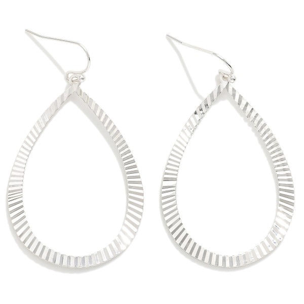 Metal Tone Teardrop Shaped  Drop Earring Featuring Textured Ridged Pattern  

- Approximately 2" L