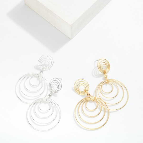 Metal Tone Hoop Drop Earring Featuring Layered Design With Dangling Accents 

- Approximately 2.50" L

