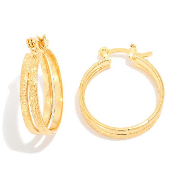 Layered Metal Tone Hoop Earrings

- Approximately .25" D
- 18k Gold Filled
- Hypoallergenic
- Made In Brazil

