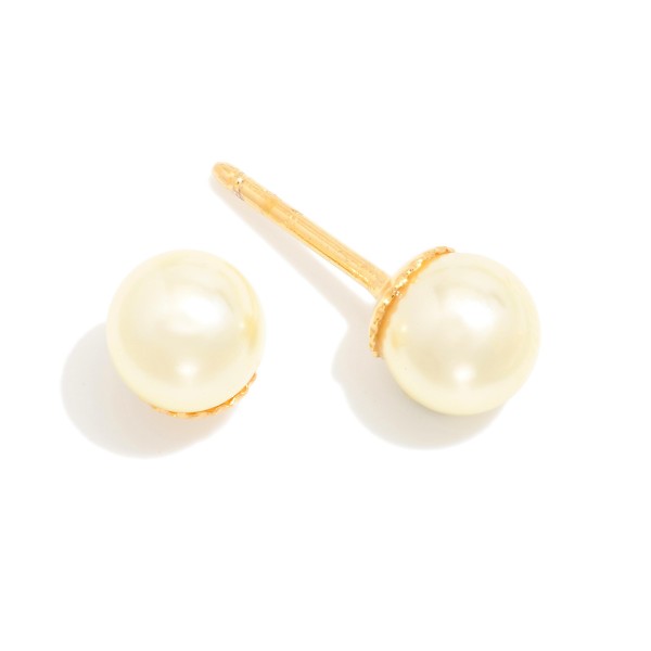 Cream Pearl Stud With Gold Tone Posts 

- Approximately .05" D
- 18k Gold Filled
- Hypoallergenic
- Made In Brazil

