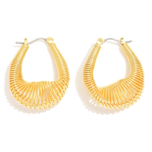 Gold Tone Slinky Coil Hoop Earring 

- Approximately 1.25" D
- 18k Gold Filled
- Hypoallergenic
- Made In Brazil


