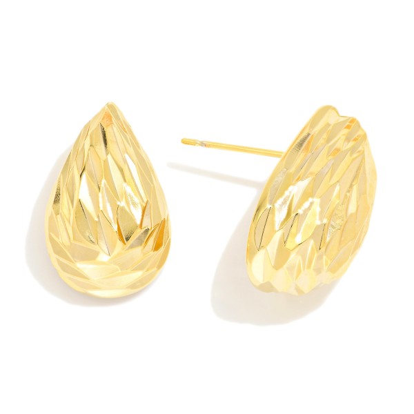 Gold Tone Textured Puffy Teardrop Earring

- Approximately .75" L
- 18k Gold Filled
- Hypoallergenic
- Made In Brazil

