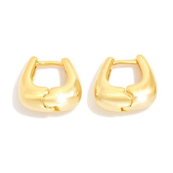 Gold Tone Huggie Hoop Earrings 

- Approximately .25" L
- Gold Filled
- Made In Brazil
- Hypoallergenic
