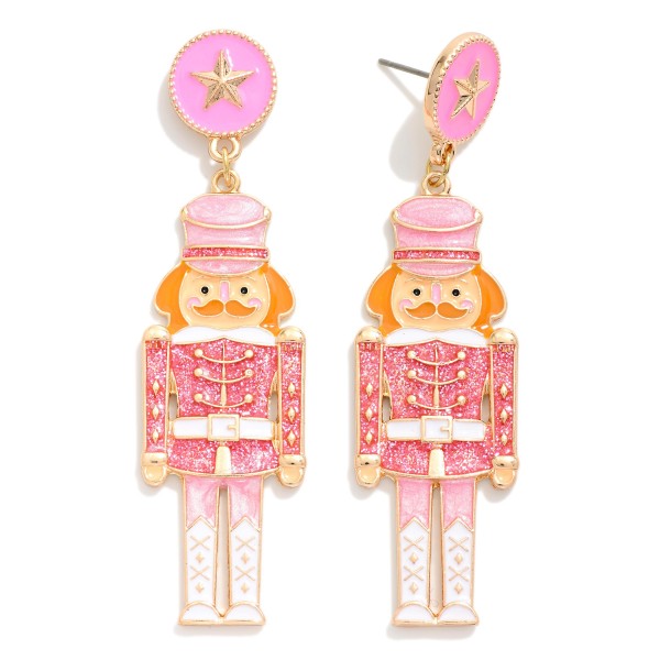 Enamel Christmas Nutcracker Drop Earrings With Star Post Drop Featuring Glitter & Gold Tones 

- Approximately 3" L