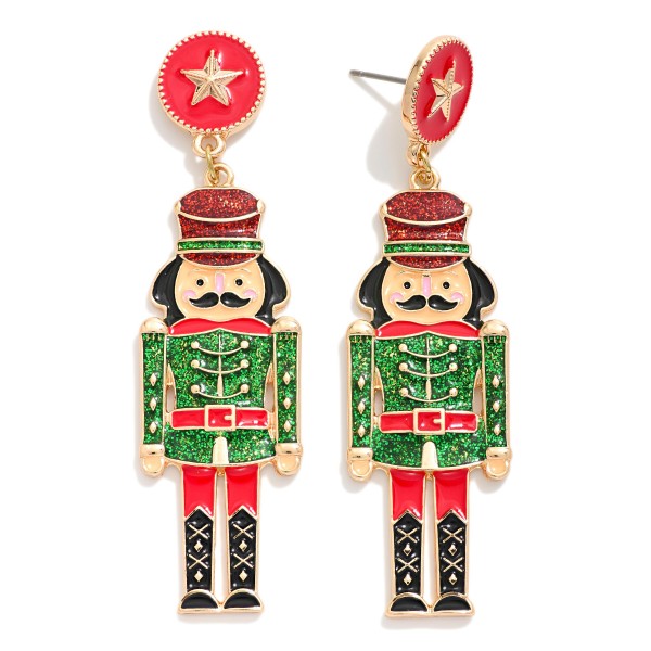 Enamel Christmas Nutcracker Drop Earrings With Star Post Drop Featuring Glitter & Gold Tones 

- Approximately 3" L