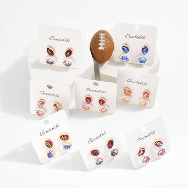 Set Of Two Game Day Stud Earrings Featuring Glitter Acetate Footballs & Pearlescent "Game Day" Detail 

- Approximately .5" L