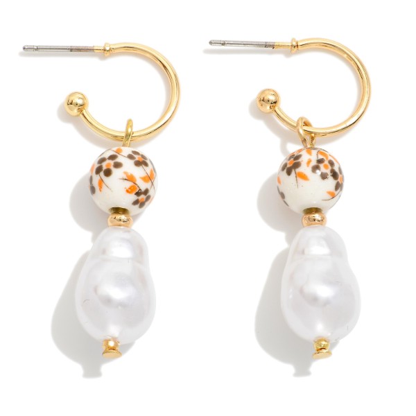 Metal Tone Drop Hoop Earrings Featuring Floral Porcelain Bead & Baroque Pearl 

- Approximately 1.5" L