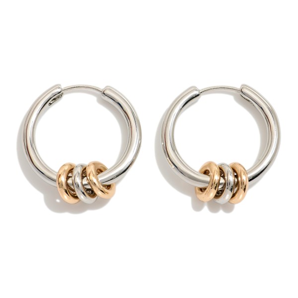 Metal tone Hoop Drop Earring Featuring Metal Tone Disc Charms 

- Approximately 1.5" 