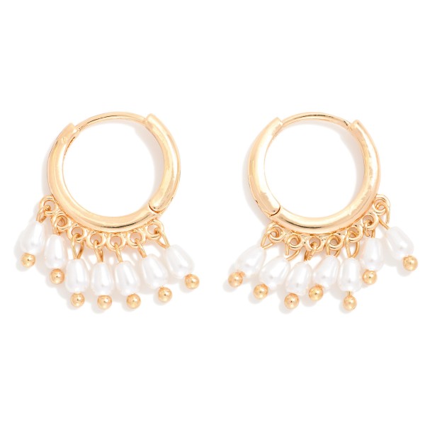 Metal Tone Huggie Hoop Drop Earrings Featuring Pearl Tassel Details

- Approximately 1" L


