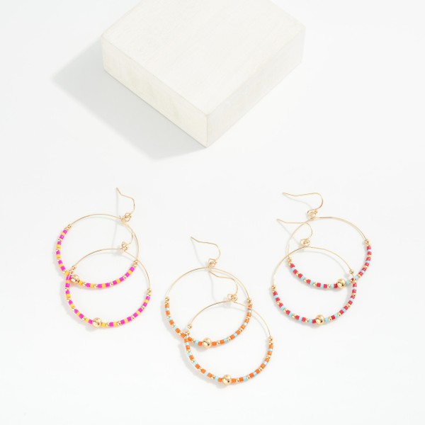 Seed Beaded Hoop Drop Earring Featuring Gold Tones 

- Approximately 2" L 