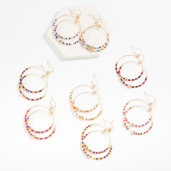 Seed Beaded Hoop Drop Earring Featuring Gold Tones 

- Approximately 2" L 
