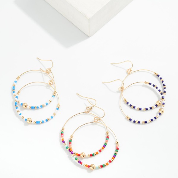 Seed Beaded Hoop Drop Earring Featuring Gold Tones 
- Approximately 2" L