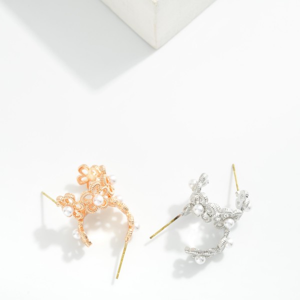 Metal Tone Flowers Hoop Earrings Featuring Pearl Details 

- Approximately .75" D