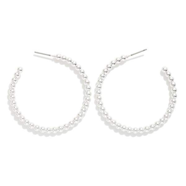Metal Tone Beaded Hoop Drop Earrings Earrings

- Approximately 1.5" L

