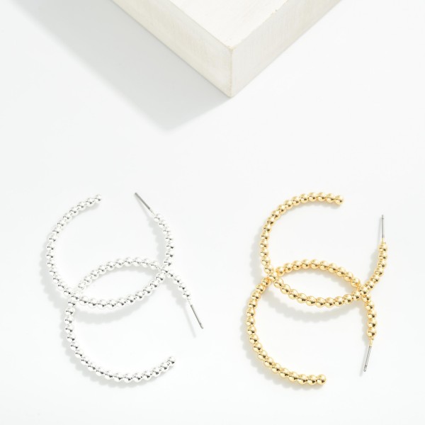 Metal Tone Beaded Hoop Drop Earrings Earrings

- Approximately 1.5" L

