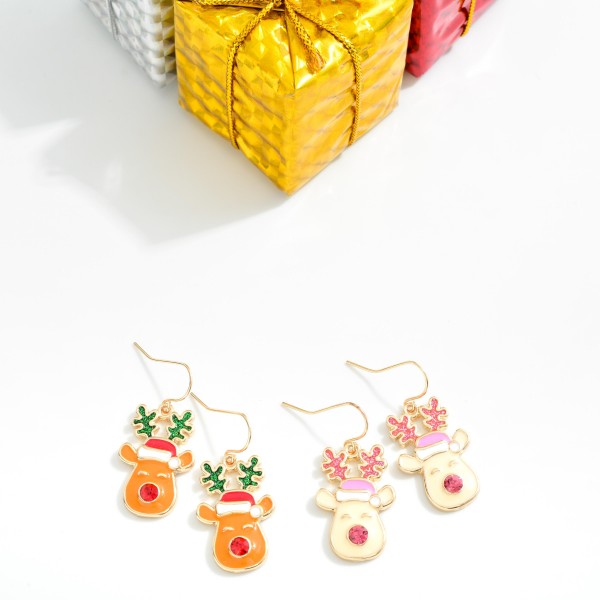 Enamel Metal Reindeer Drop Earrings Featuring Glitter & Rhinestone details 

- Approximately 1.25" L

