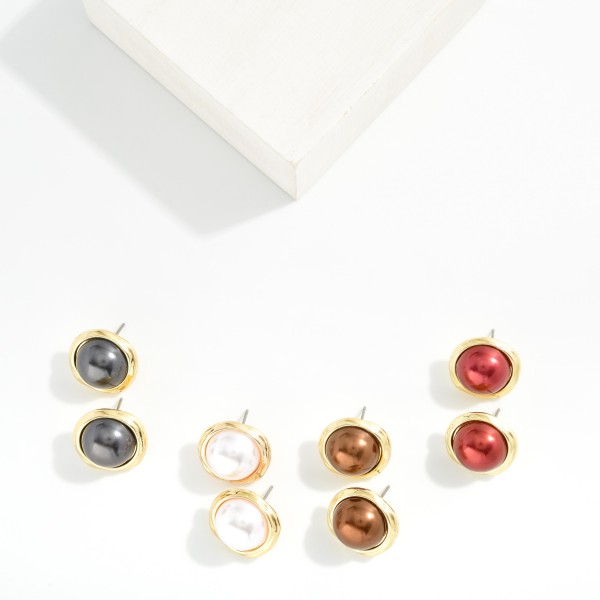 Metal Tone Post Stud Earrings Featuring Metallic Ball And Gold Tone Frame

- Approximately .75" D

