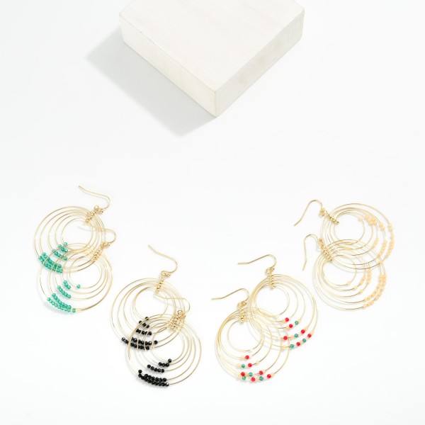 Linked Simple Wire Metal Hoop Drop Earring Featuring Bead Details 

- Approximately 2" L
