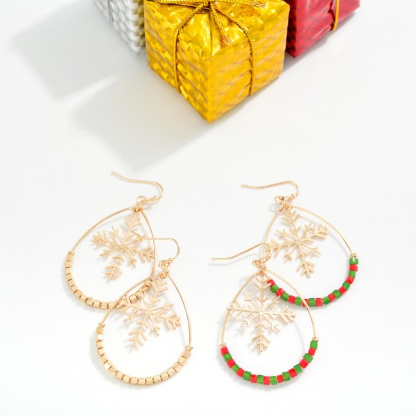 Beaded Teardrop Earrings Featuring Metal Tone Snowflake Detail 

- Approximately 2" L