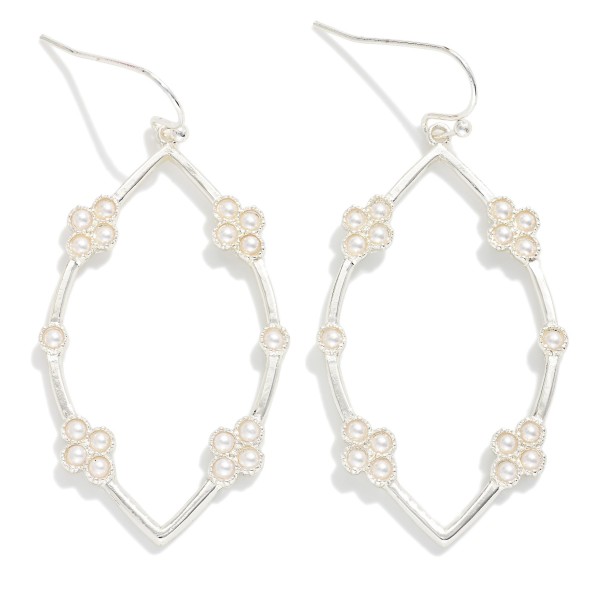 Metal Tone Leaf Shape Drop Earrings Featuring Pearl Cluster Details

- Approximately 1.5" L
