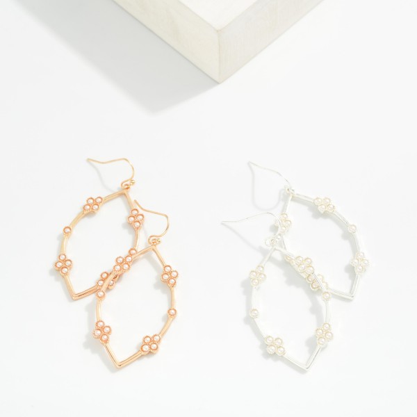 Metal Tone Leaf Shape Drop Earrings Featuring Pearl Cluster Details

- Approximately 1.5" L
