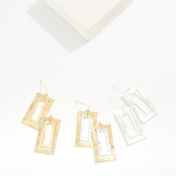 Nesting Metal Tone Ribbed Rectangle Drop Earrings 

- Approximately 2" L