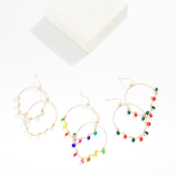 Metal Tone Wire Half Hoop Drop Earring With Linked Rhinestone Dangle Details 

- Approximately 2" L 