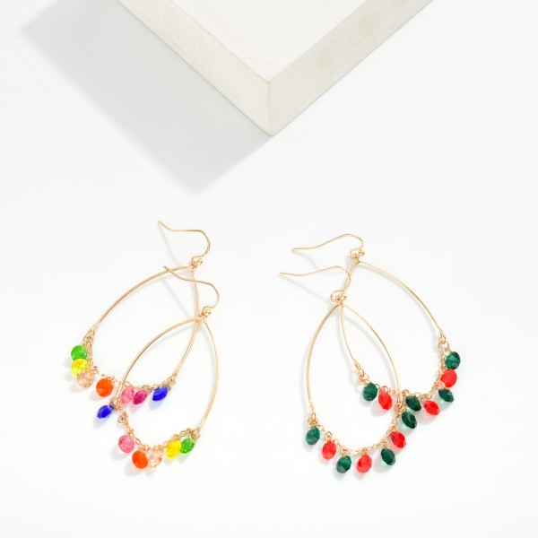 Metal Tone Wire Half Oval Drop Earring With Linked Rhinestone Dangle Details 

- Approximately 2" L 