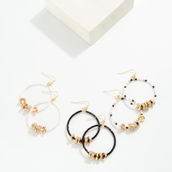 Seed Beaded Hoop Drop Earring Featuring Gold Tone Rhinestone Studded Discs 

- Approximately 2" L 