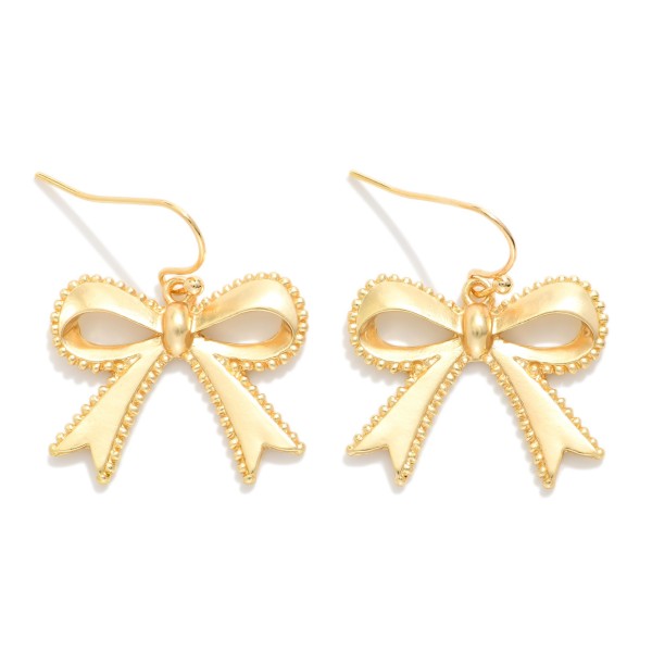 Metal Tone Bow Drop Earrings Featuring Studded Edge Detail 

- Approximately 1" L