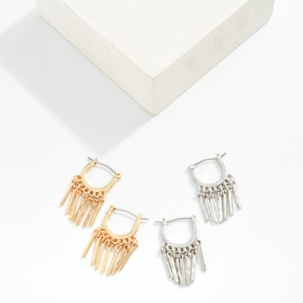 Metal Tone Huggie Hoop Drop Earrings Featuring Tassel Details

- Approximately 1" L
