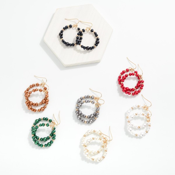 Metallic Beaded Hoop Drop Earring Featuring Metal Tone Bead Stations 

- Approximately 1.75" L 