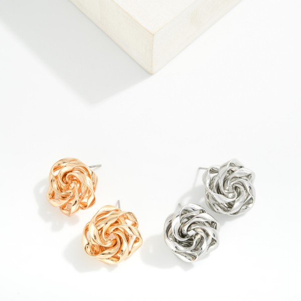 Metal Tone Big Knot Stud Earring 

- Approximately .75" L 