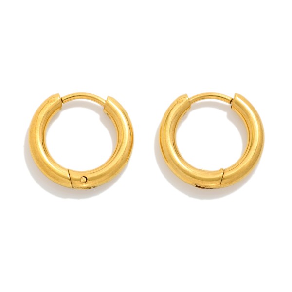 Metal Tone Huggie Hoop Earrings

- Approximately .25" D
- Hypoallergenic 
- Water Resistant 
