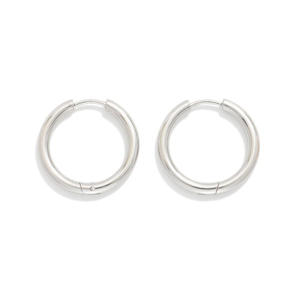 Metal Tone Huggie Hoop Earrings

- Approximately .75" D
- Hypoallergenic 
- Water Resistant 
