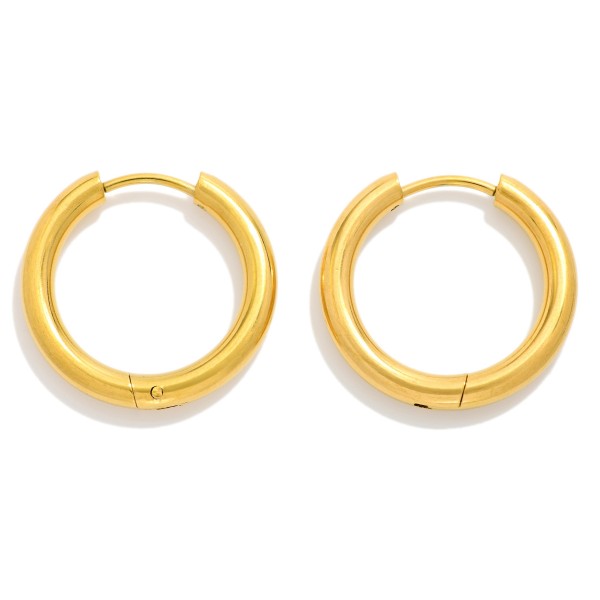 Metal Tone Huggie Hoop Earrings

- Approximately .75" D
- Hypoallergenic 
- Water Resistant 