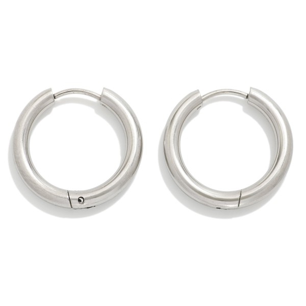 Metal Tone Huggie Hoop Earrings

- Approximately .75" D
- Hypoallergenic 
- Water Resistant 