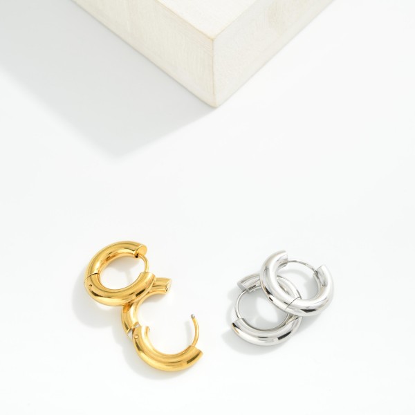 Chunky Metal Tone Huggie Hoop Earrings

- Approximately .25" D
- Hypoallergenic
- Water Resistant 
