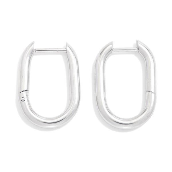 Metal Tone Hinged Oval Hoop Earrings 

- Stainless Steel
- Water Resistant
- Approximately .5" D