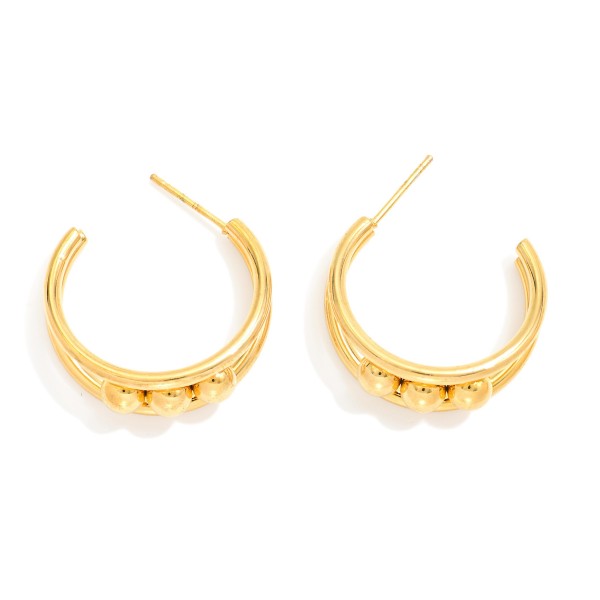 Layered Tapered Metal Hoop Earrings With Metal Ball Details 

- Stainless Steel
- Water Resistant
- Approximately .75" D