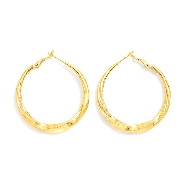 Twisted Metal Hoop Earrings 

- Stainless Steel
- Water Resistant
- Approximately 1.25" D