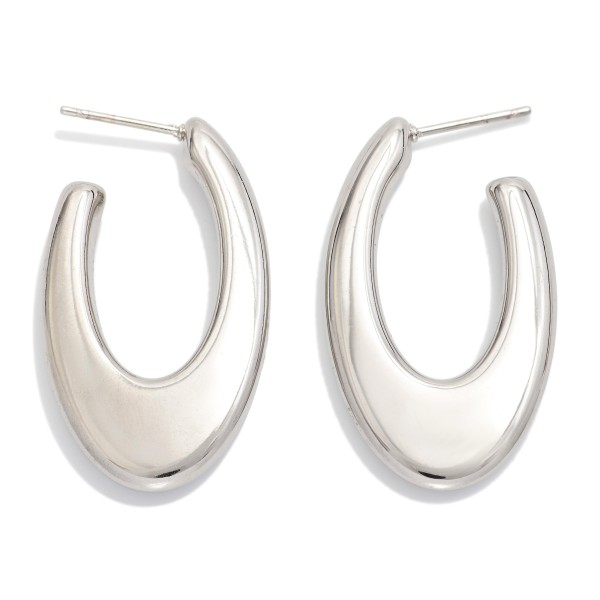 Tapered Metal Tone Oval Hoop Earrings 

- Stainless Steel
- Water Resistant
- Approximately 1.25" L
