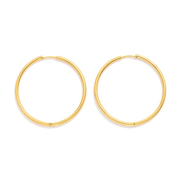 Metal Tone Huggie Hoop Earrings

- Approximately 1.5" D
- Hypoallergenic 
- Water Resistant 
