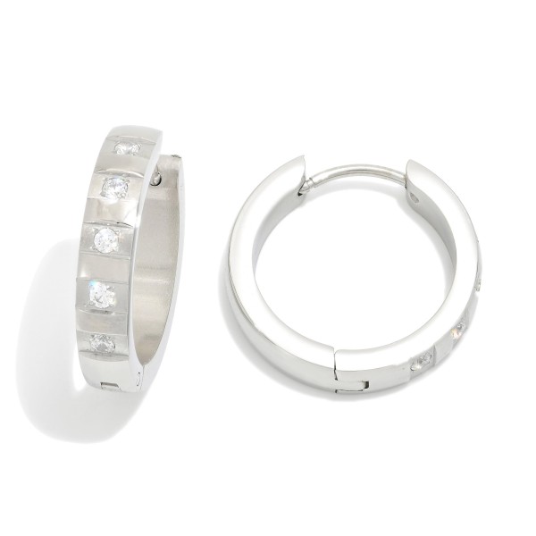Metal Tone Hoop Earrings Featuring Rhinestones Details 

- Stainless Steel
- Water Resistant
- Approximately .75" D
